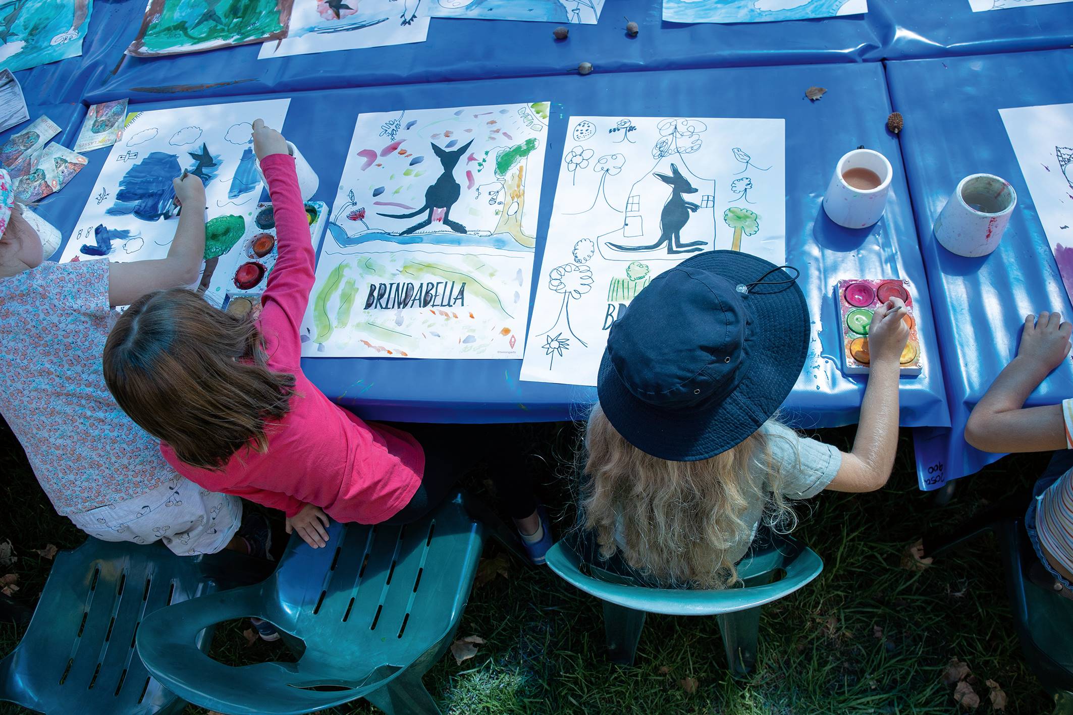 Children painting kangaroos at a past Kids' Day event.