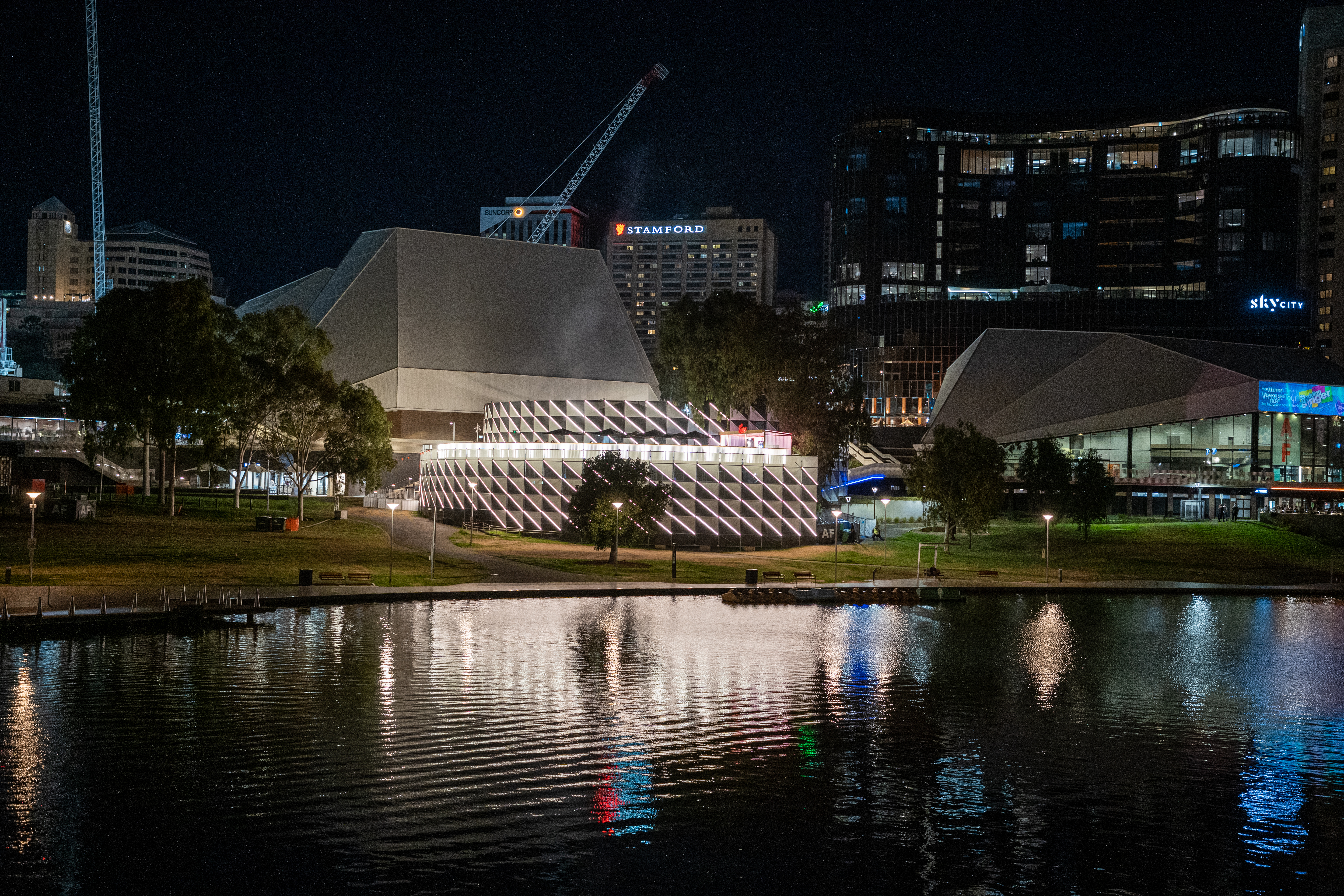 The Summerhouse, a large black-and-white chequered pavillion, sits between the Adelaide Festival Centre and Karrawirra Parri (River Torrens).
