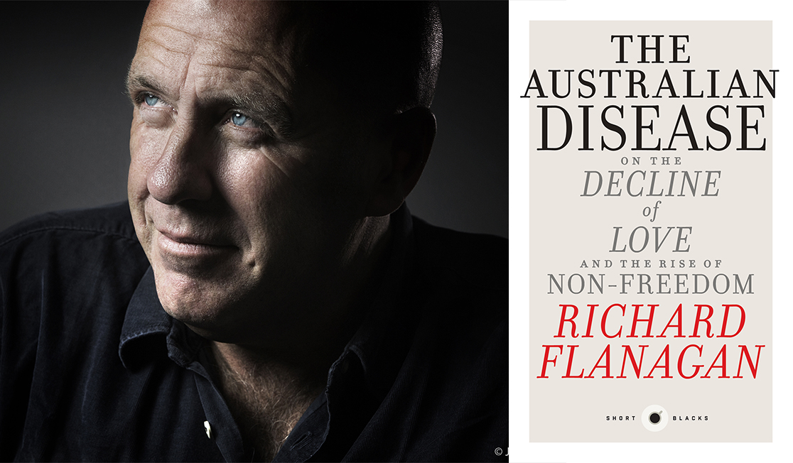 Richard Flanagan is looking to the left, wearing a black button up shirt and smiling